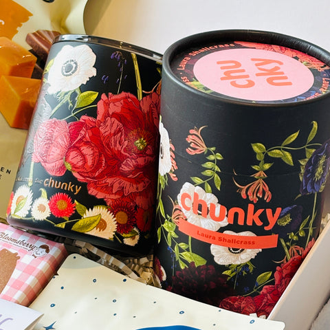 'chunky' branded tins with floral designs on a white surface.
