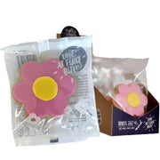 Packaged shortbread cookie in shape of a pink flower design icing