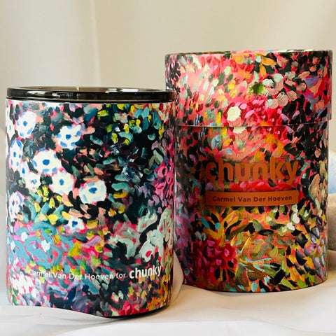 colorful cup with floral patterns on a white surface