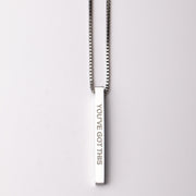  'YOU'VE GOTTHIS' engraving on a light gray background
